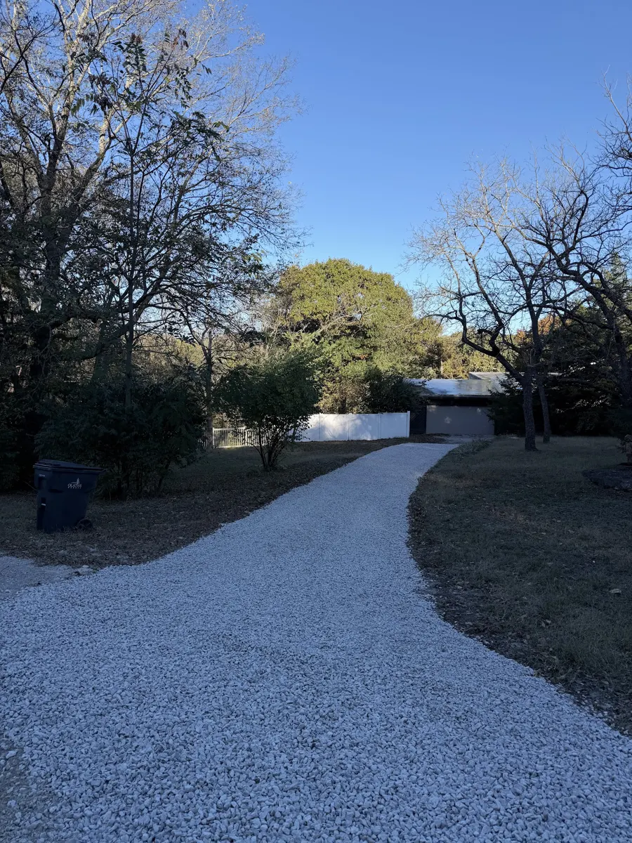 Fresh gravel driveway curving toward the house, posted by Shari Riddle
