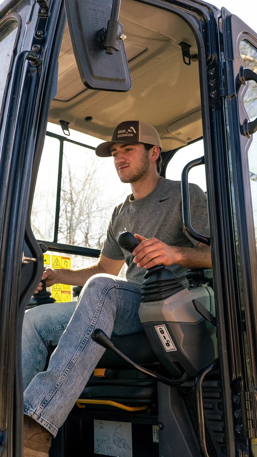 Ashton in the excavator cab