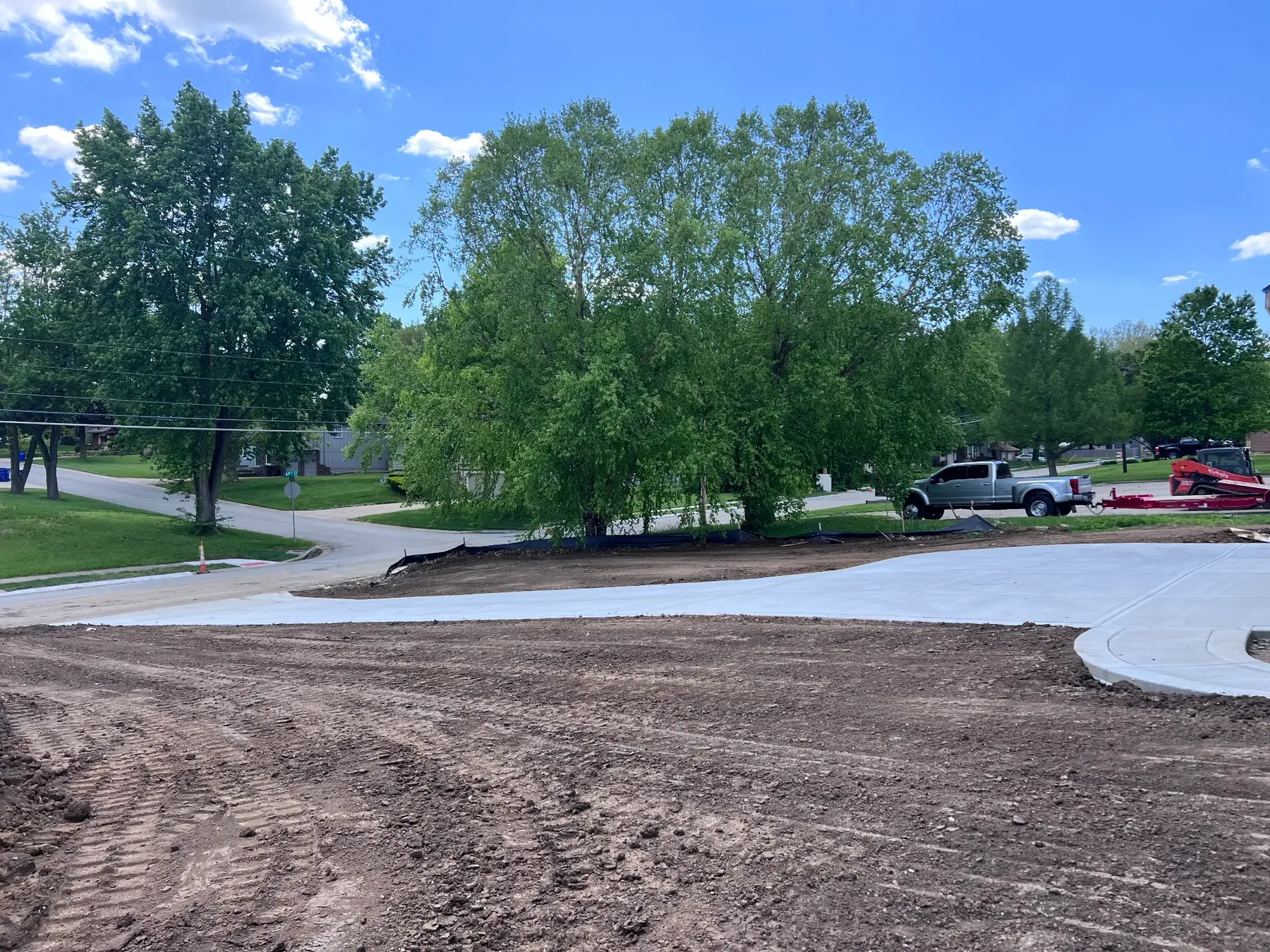 Finished concrete drive and graded frontage at a commercial building